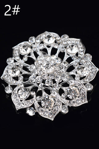 Luminoso broche del diamante